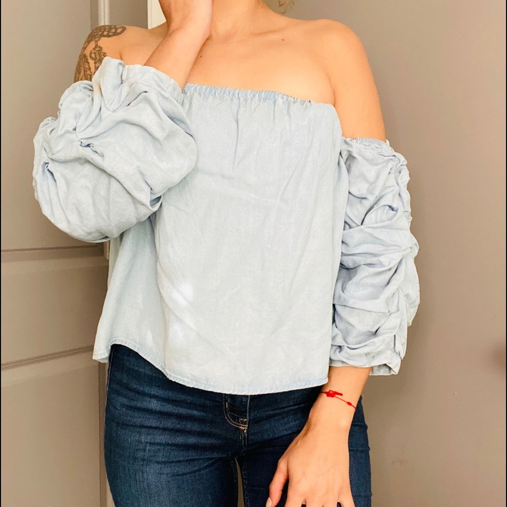 OF-THE-SHOULDER RUFFLED DENIM SHIRT